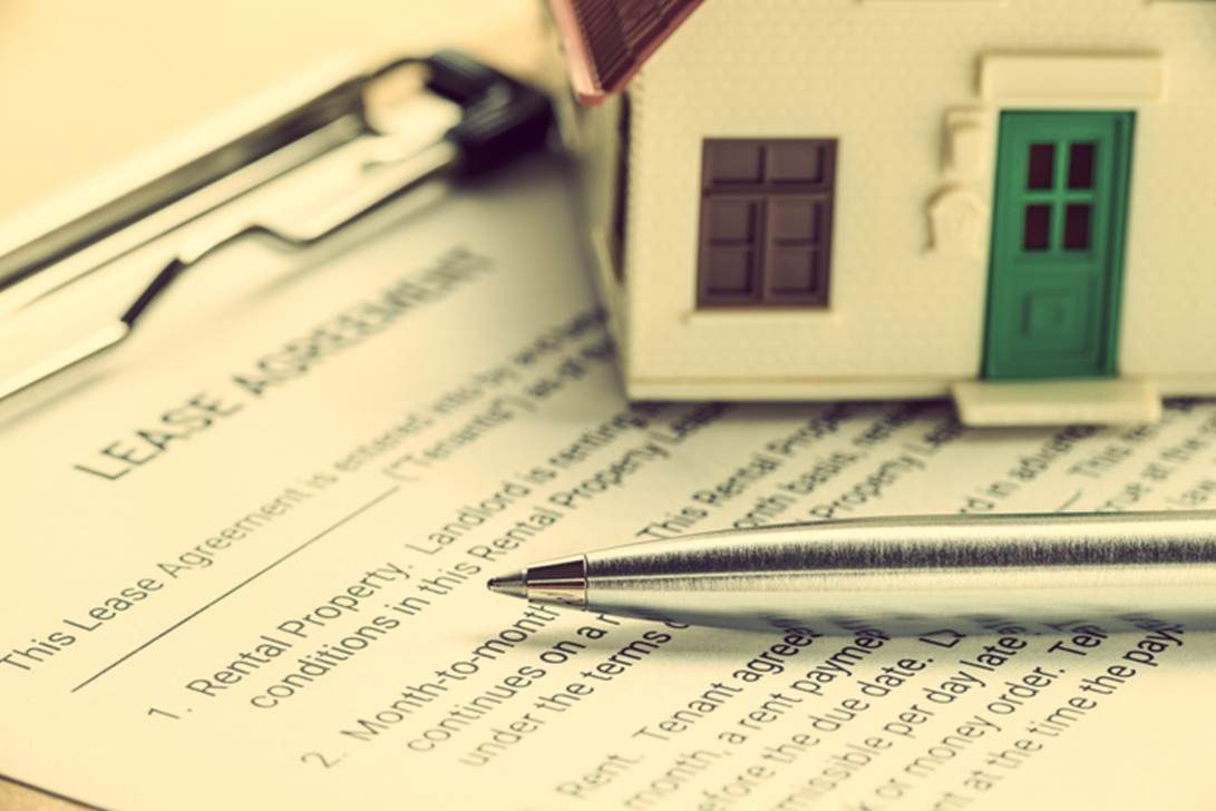 A pen and a model house on a paper
AI-generated content may be incorrect.